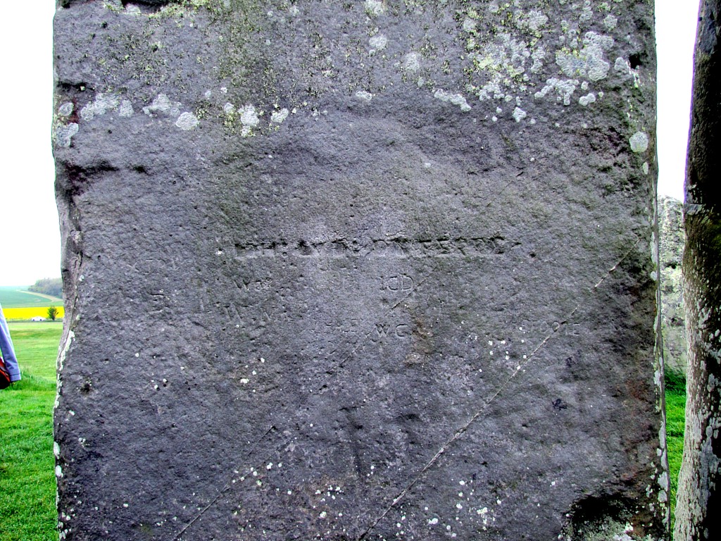 Graffiti on the stones. The deep-cut, straight line is from the Tudor era, so around 400 years old. Most of the rest seem to be later, around Victorian era. But down near the bottom, there are carvings of a dagger and a hammer, that date from the early bronze age, so around 3000 - 4000 years old.