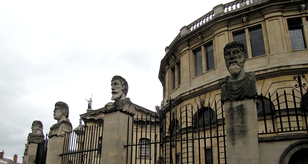 Okay. These heads, on the fence surrounding the Sheldonian Theatre, are called the Philosophers. That said, no one seems really sure who or what they represent: philosophers, emperors, the disciples, or what. The fact that they have kind of slack-jawed, gormless expressions, the sarcastic title of Philosophers seems to have stuck.